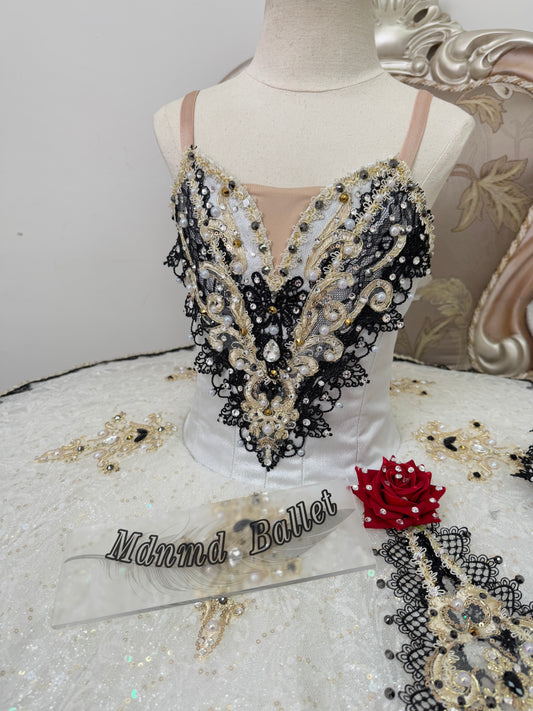 An elegant white ballet tutu adorned with lace and sequin embellishments.-MDT1282