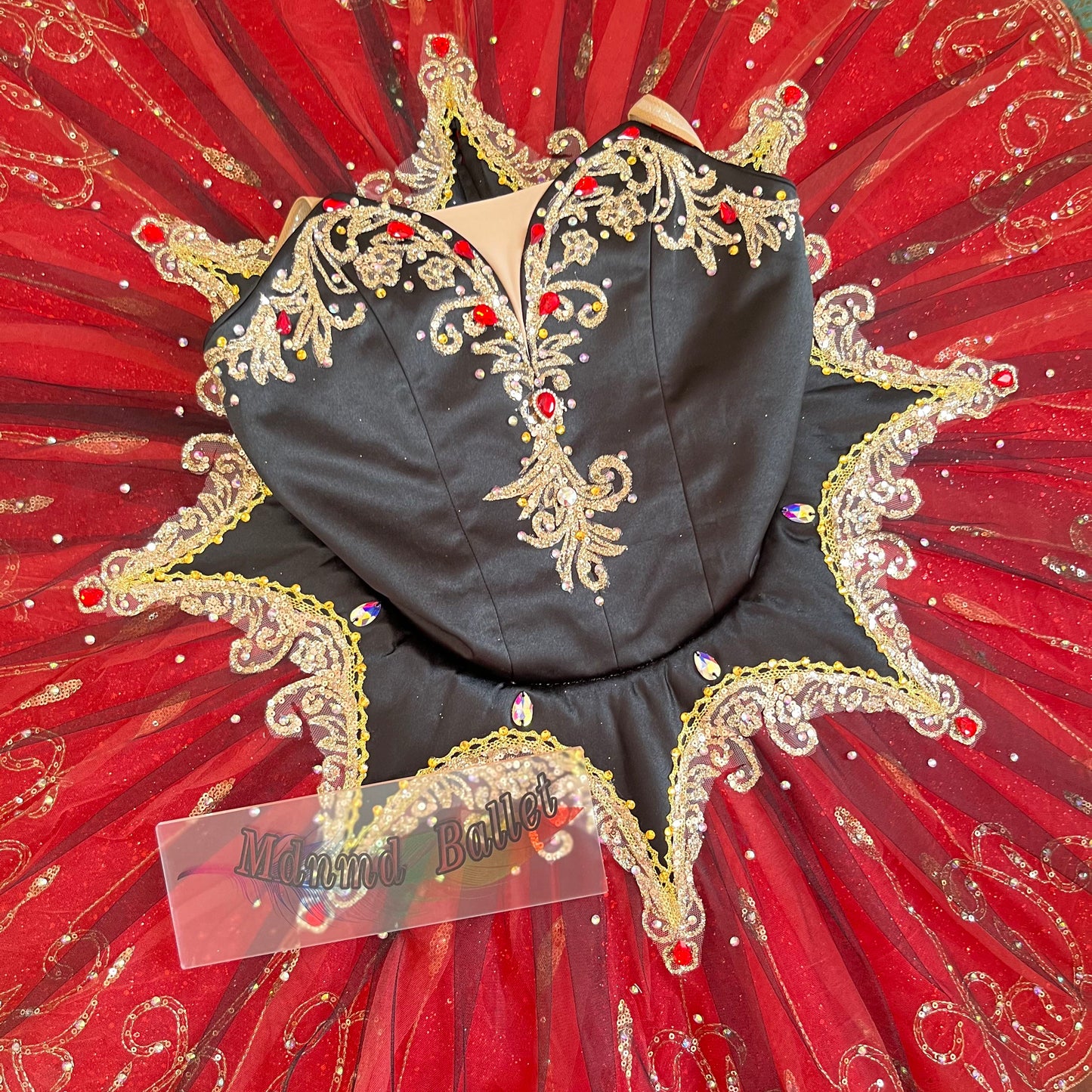 A passionate red ballet tutu, adorned with lace and sequins, is a professional ballerina's ballet tutu.-MDT0538