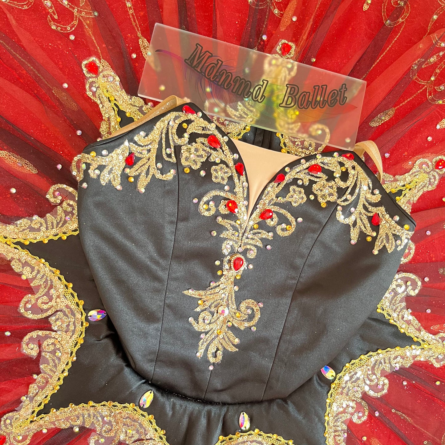 A passionate red ballet tutu, adorned with lace and sequins, is a professional ballerina's ballet tutu.-MDT0538