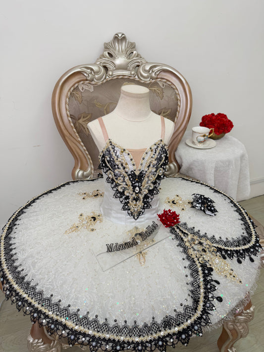 An elegant white ballet tutu adorned with lace and sequin embellishments.-MDT1282