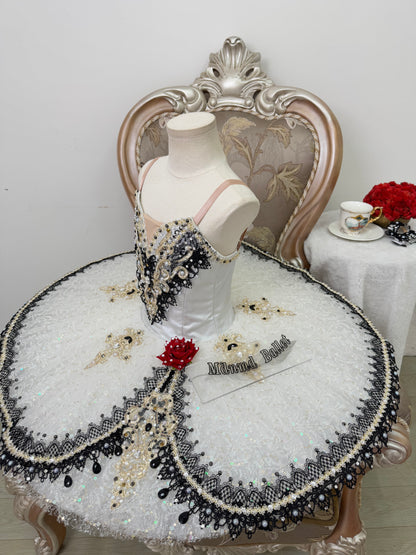 An elegant white ballet tutu adorned with lace and sequin embellishments.-MDT1282