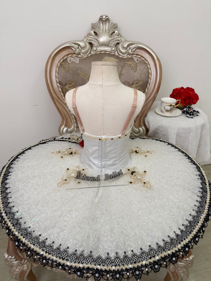 An elegant white ballet tutu adorned with lace and sequin embellishments.-MDT1282
